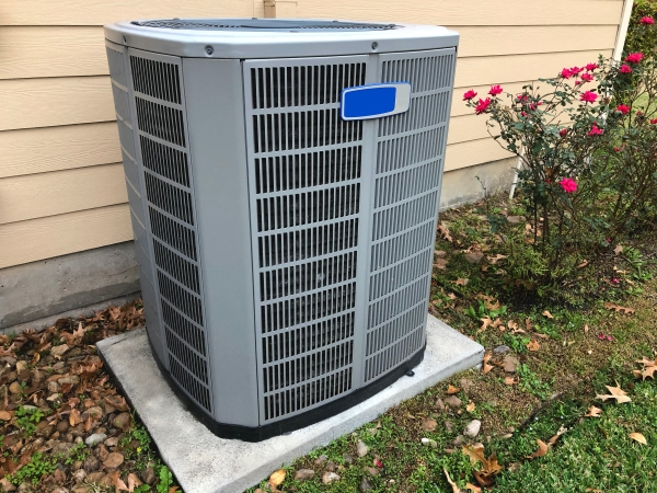 New air conditioning unit outside residential home.